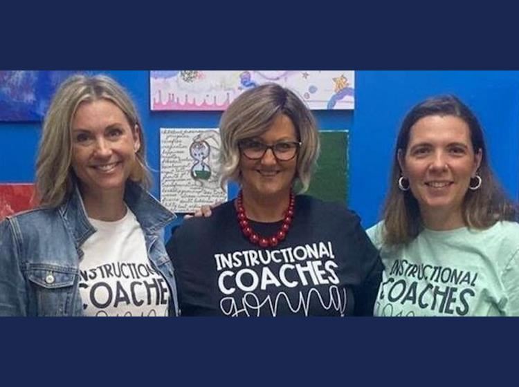three women wearing shirts that read instructional coaches